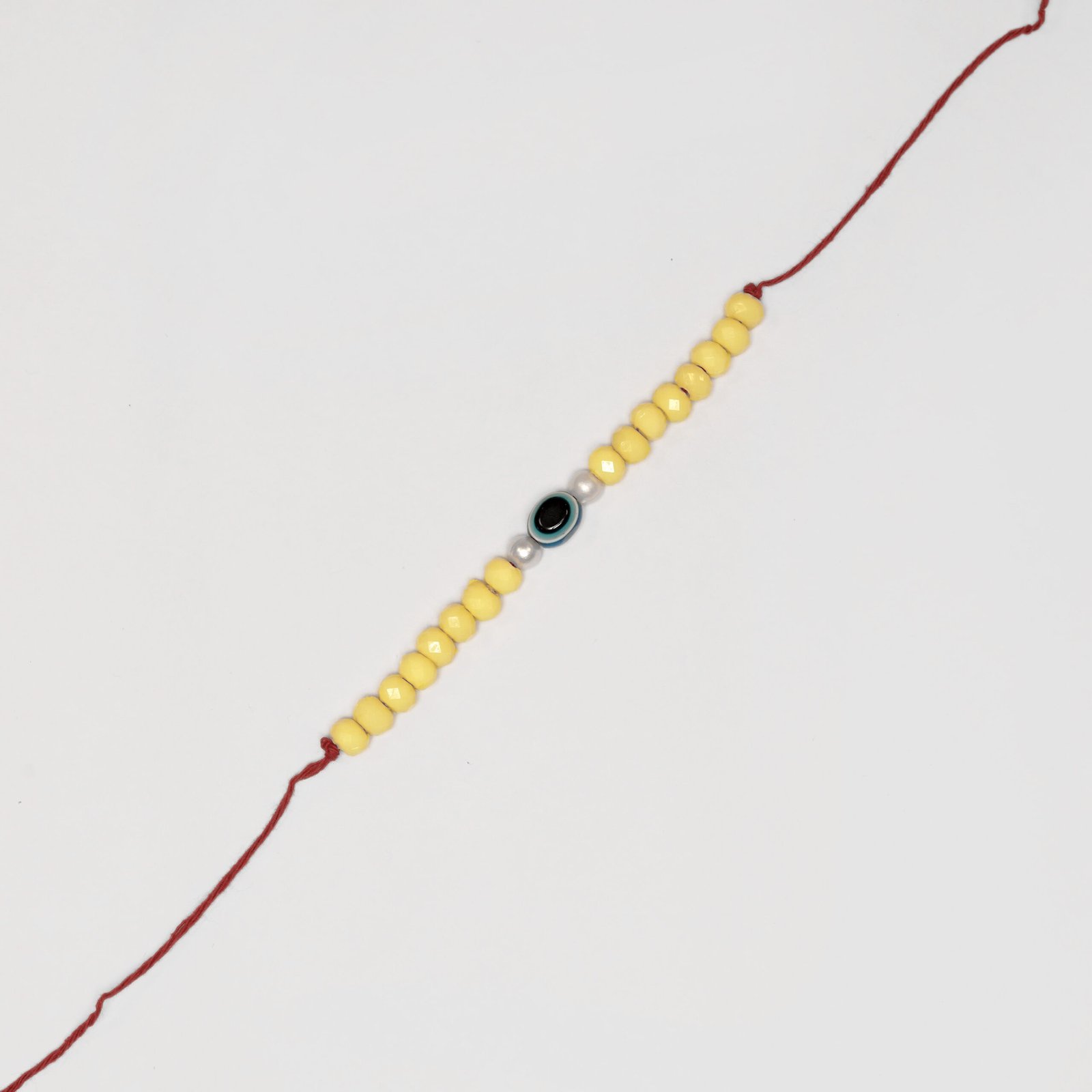 Yellow Evil Eye Rakhi - Image 3